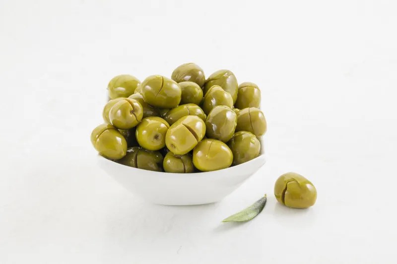 Bodrum cracked green olives in their existing bowl presentation